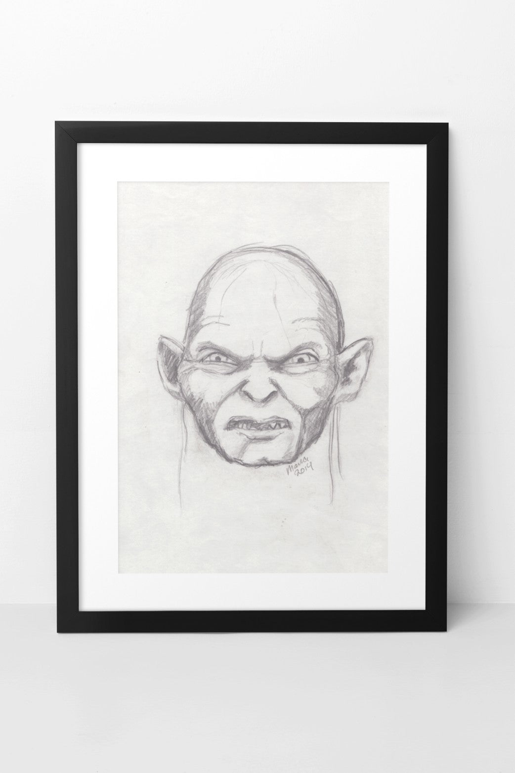 Pencil drawing of Gollum from The Lord of the Rings, depicted in grayscale. The artwork features a close-up of his angry face, capturing his intense and menacing expression. The A4-sized artwork is displayed in a black mock-up frame against a neutral background, emphasizing its dramatic detail and grayscale tones.