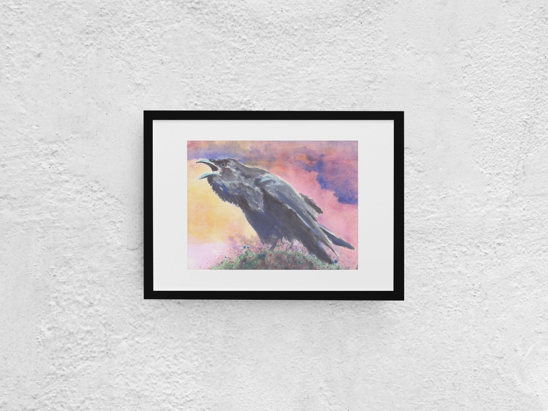 Watercolor painting of a raven cawing in the early morning as the sun rises against a pink autumn sky. The raven, painted in black and grays, stands on a tree branch or moss covered with berries, preparing for a light snack. The sky features soft tones of blue, pink, and yellow. The A4-sized artwork is displayed in a black mock-up frame against a neutral background, emphasizing its serene yet lively autumn scene.