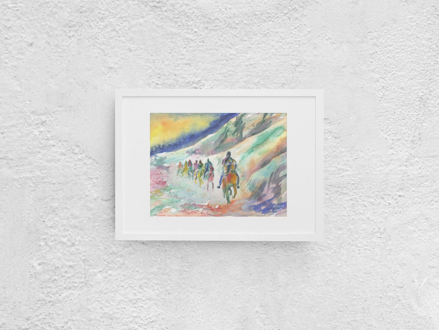 A vibrant painting depicting a group of people on a horseback riding trip beneath a towering mountainous cliff. The painting showcases a variety of hues, including grey, green, orange, red, pink, and white. The sky behind them is split into strong blue and yellow tones, adding dramatic contrast to the scene. The A4-sized artwork is displayed in a white mock-up frame against a neutral background, emphasizing its dynamic use of color and landscape.
