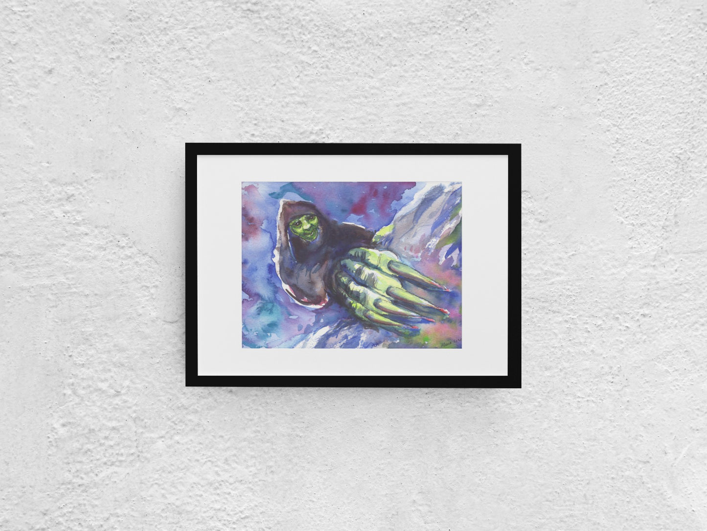Watercolor painting of Grýla shown up close, with her hand featuring large claws even closer, as if she is crawling up toward the viewer. Her shadowy figure is contrasted by her green face and hand, which are highlighted. Grýla has a nefarious smile on her face. The background is filled with contrasting white, blue, and purple tones that stand out against the green and black elements of her figure. The A4-sized artwork is displayed in a black mock-up frame against a neutral background.