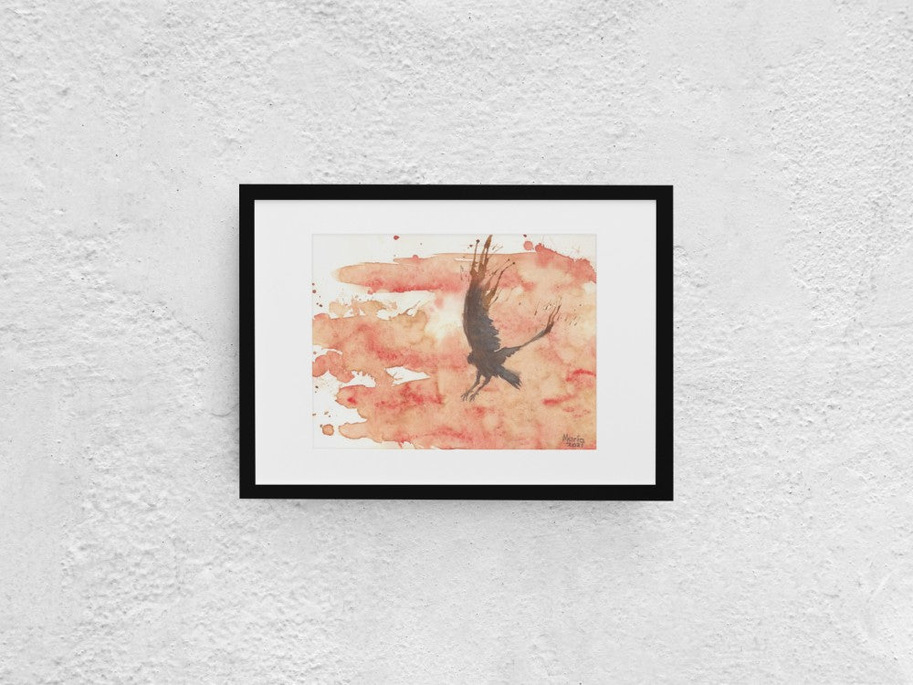 A watercolor and coffee painting of a black raven in mid-flight with its wings raised high and feet stretched, as if preparing to land. The background features a vibrant reddish-orange hue, resembling a hot summer day. The A4-sized artwork is displayed in a black mock-up frame against a neutral background, emphasizing the contrast between the dark raven and the vivid background.