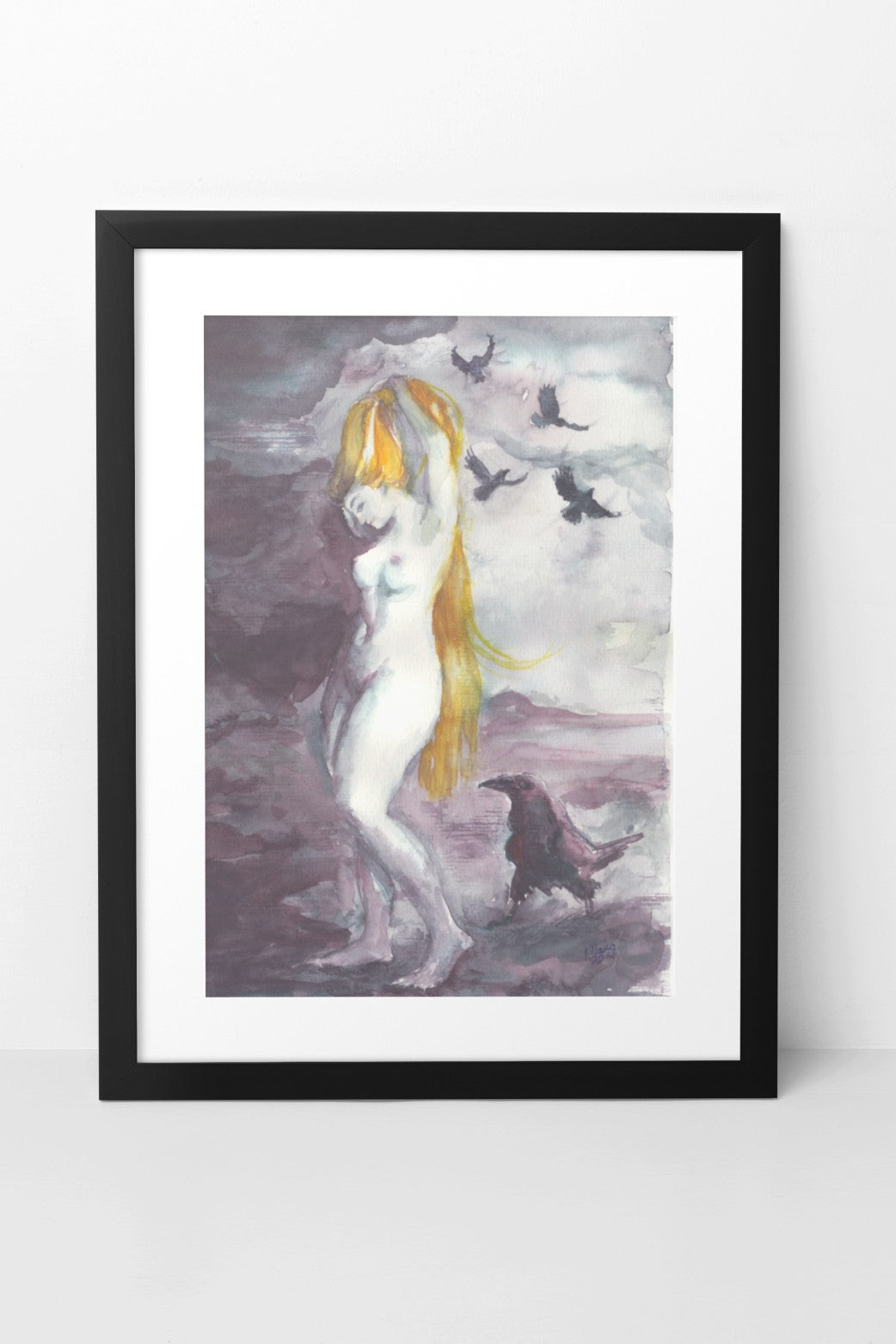 Watercolor painting of a naked fair-skinned woman brushing her long golden hair beside a raven that has landed and is looking at her. Four other ravens are flying above her. The colors are dark and soft, primarily black, gray, and purple, creating a mysterious and ethereal atmosphere. The A4-sized artwork is depicted in a black mock-up frame against a white wall background.